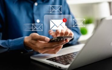 Businesswomen using smartphones check New email notifications and business digital online marketing. Inbox receiving electronic message alert. icon envelope virtual screen, communication technology.