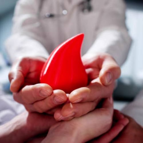 Hemophilia World Day. Doctors With Donor Blood Drop