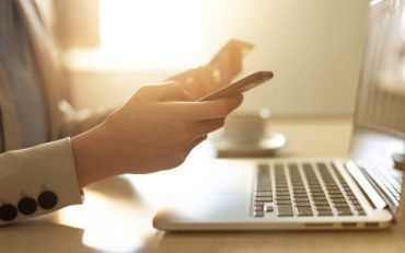 Close up of hands shopping online